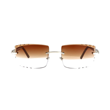 Cartier platinum acetate sunglasses with rounded frames and dark lenses, showcasing a classic, elegant design from circa 2010.