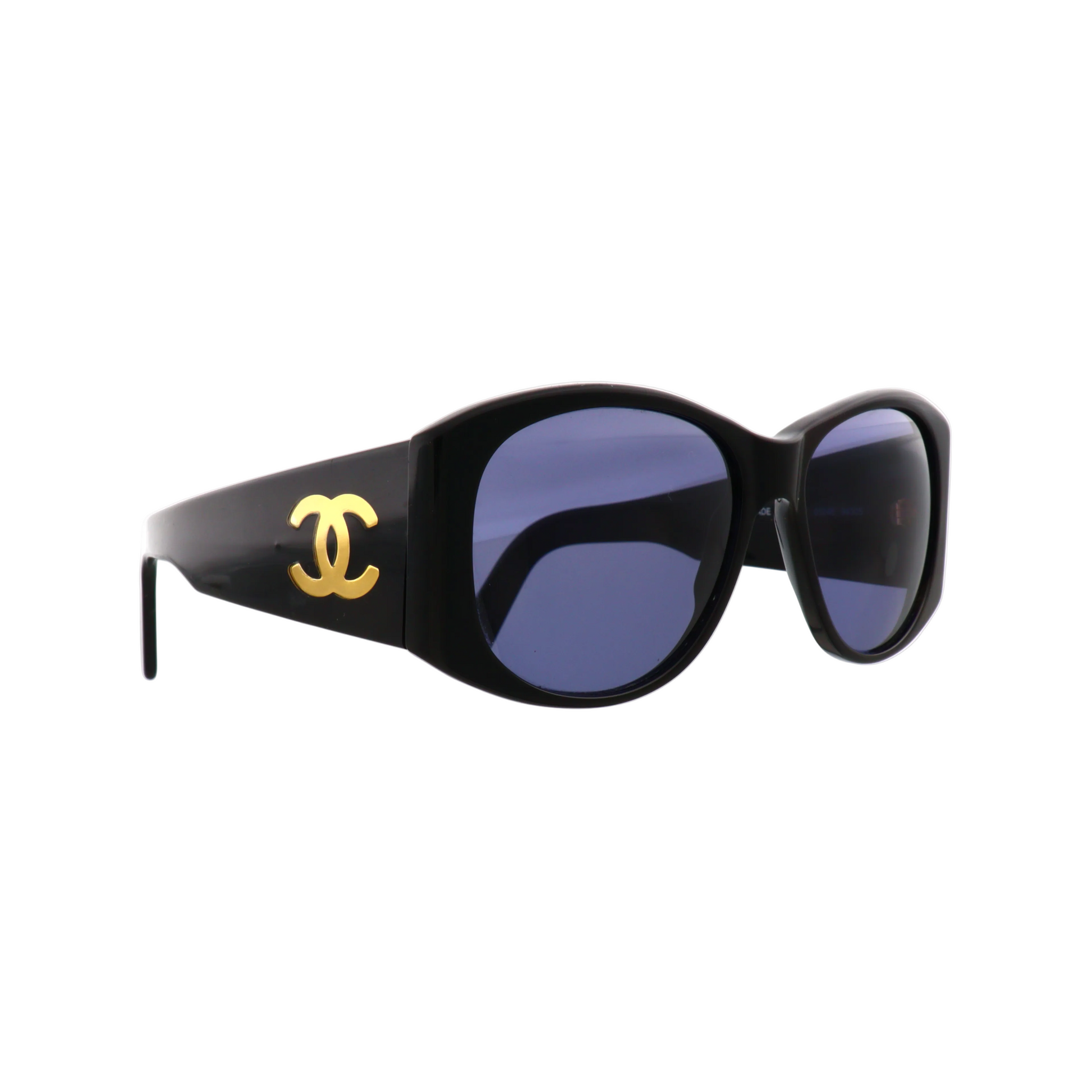 Chanel sunglasses with purple tinted lenses and black frames, side view showing stylish design and brand logo detail.