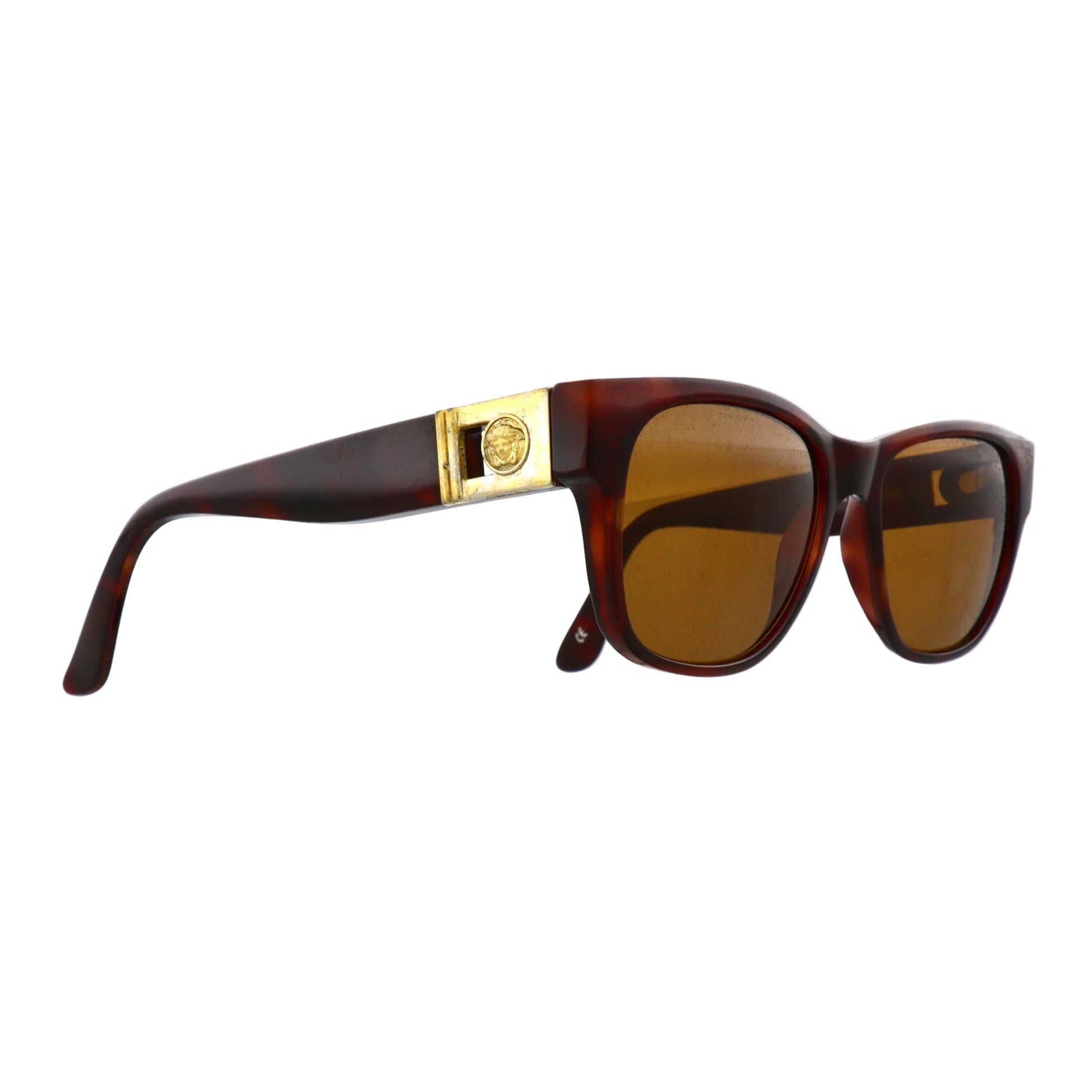Black Gianni Versace sunglasses model 411A with dark tinted lenses and stylish frames, showcasing a luxury designer eyewear look.