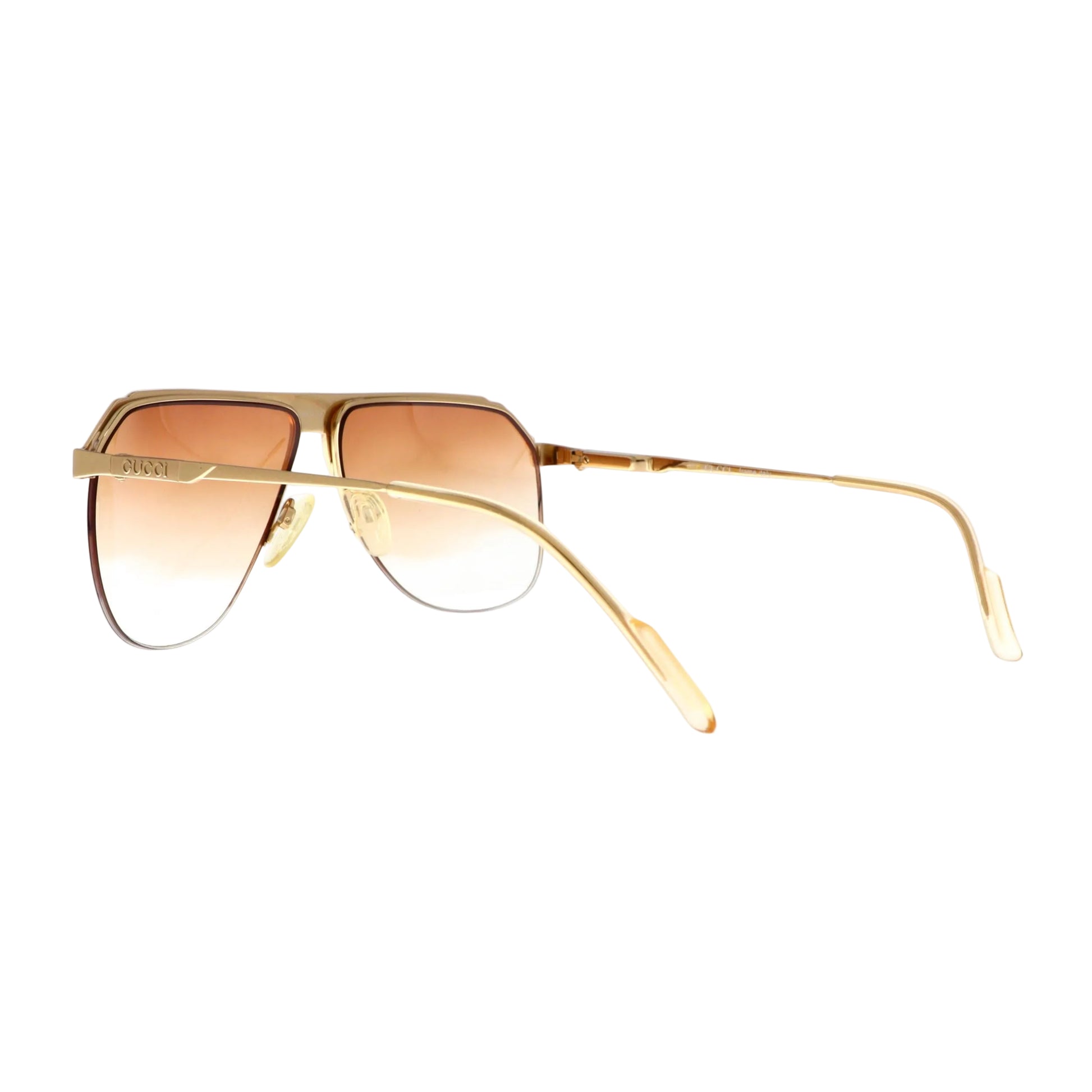 Gucci GG 1202 sunglasses with gold frame and dark lenses, stylish eyewear for a fashionable look.
