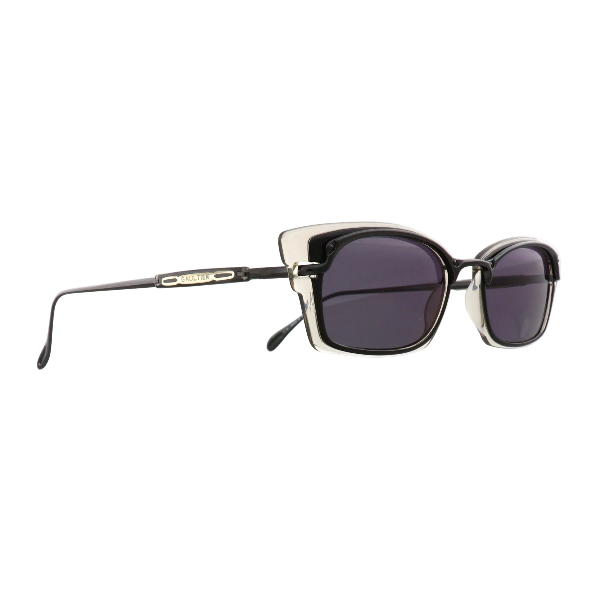 Black Jean Paul Gaultier sunglasses model 56-0039 with sleek design and tinted lenses, shown from a side view.