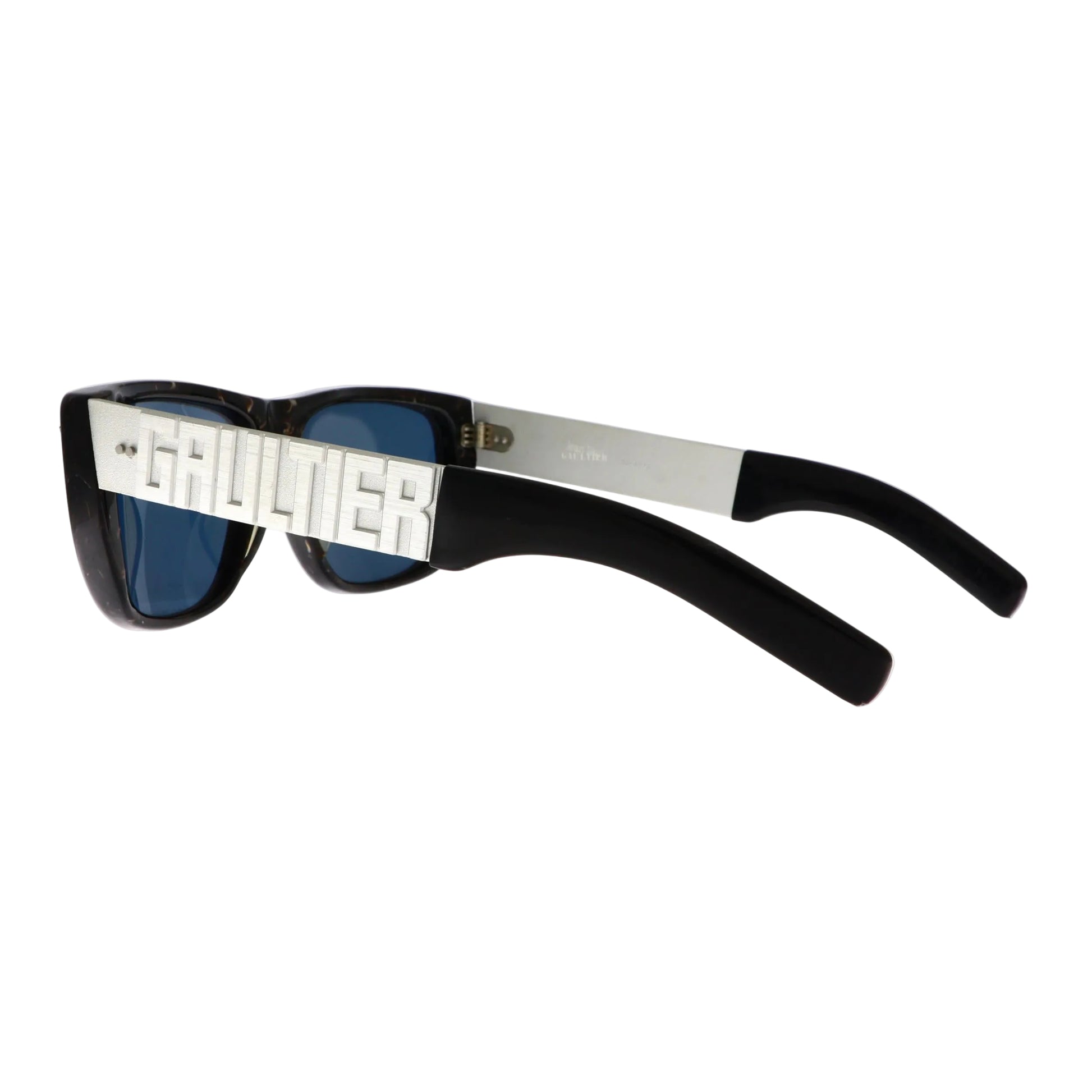 Silver Jean Paul Gaultier sunglasses model 56-8272 with a bold frame and stylish design, shown from the back.