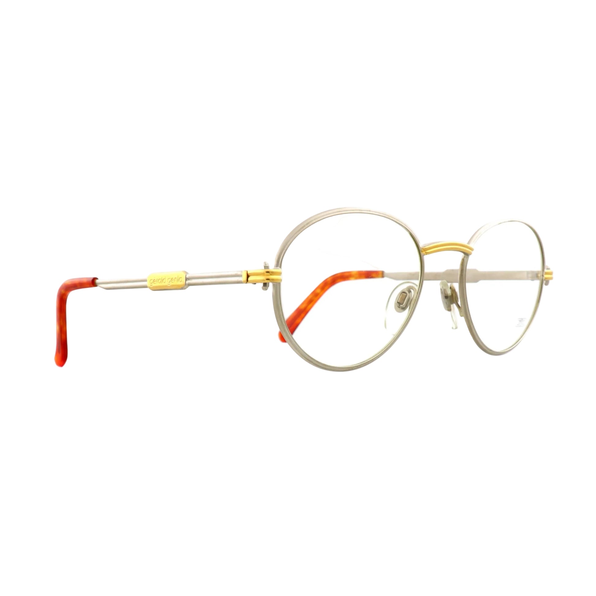 Gerald Genta New Classic 02 sunglasses by Orama, silver frame with dark lenses, showcasing stylish eyewear design.