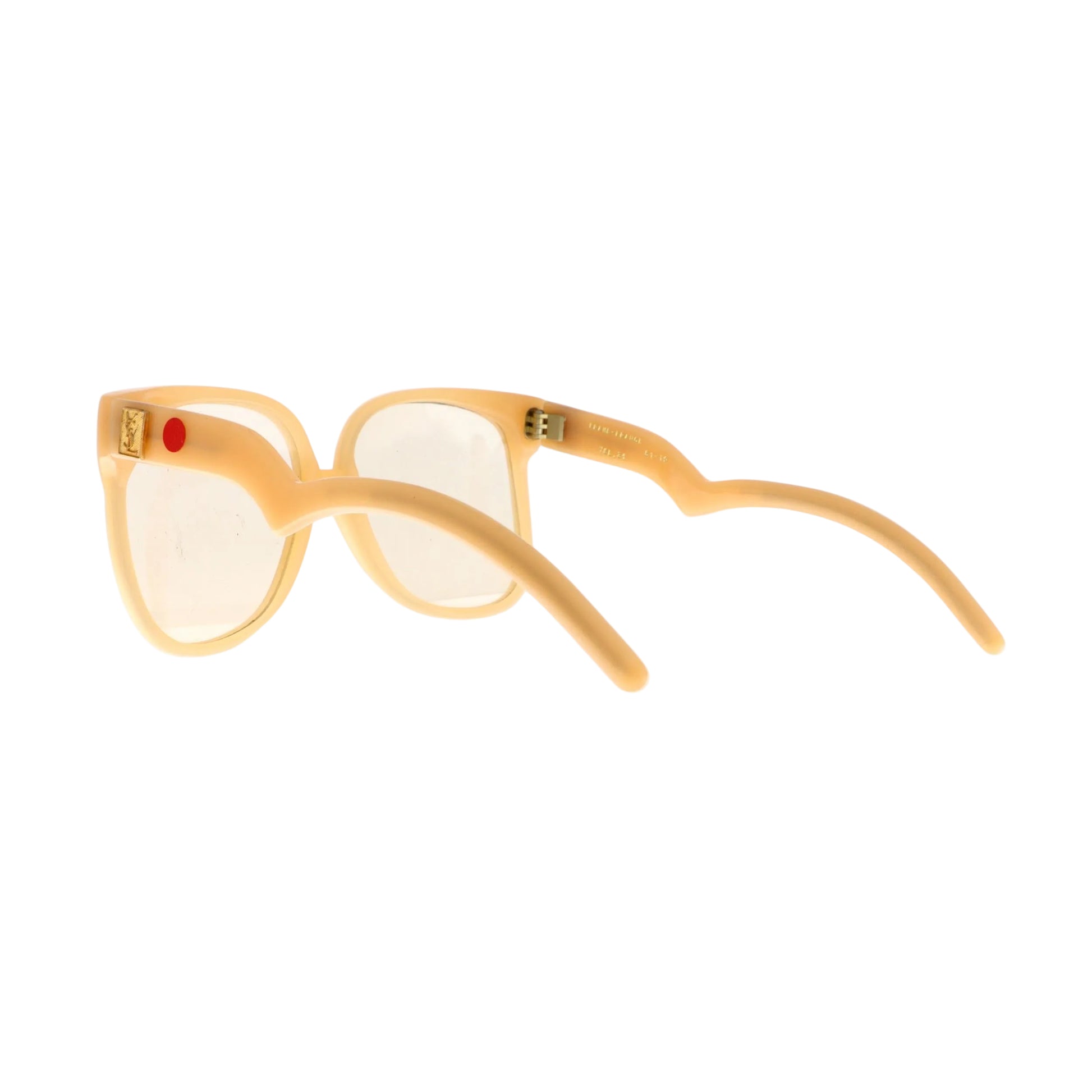 Yellow sunglasses with gold accents on a white surface
